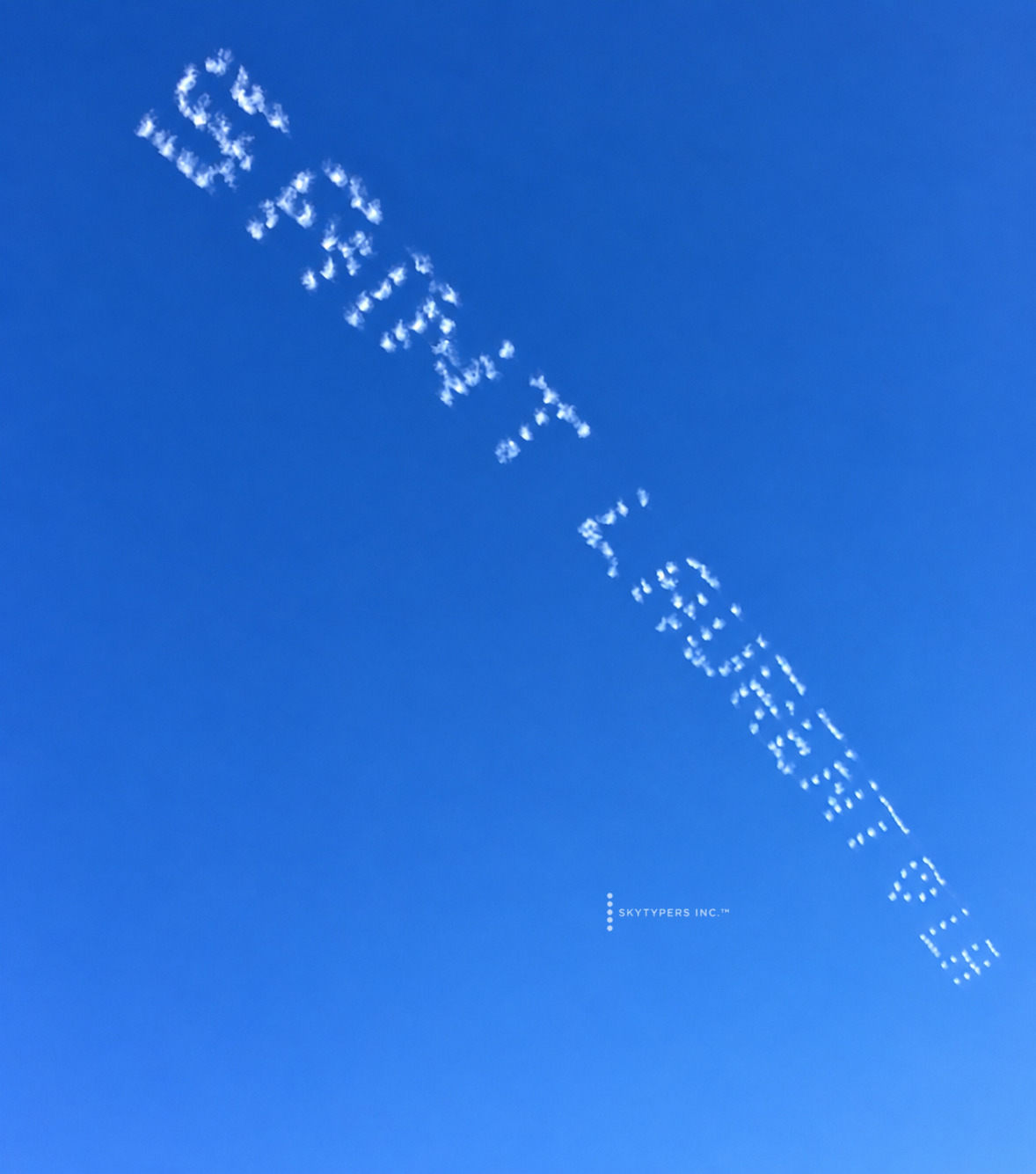 Diagonal white skytyped lettering receding from upper left to lower right.