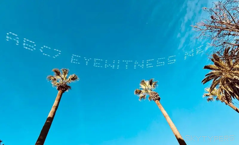 Dotted skytyping above Pasadena palms in the Skytypers campaign archive