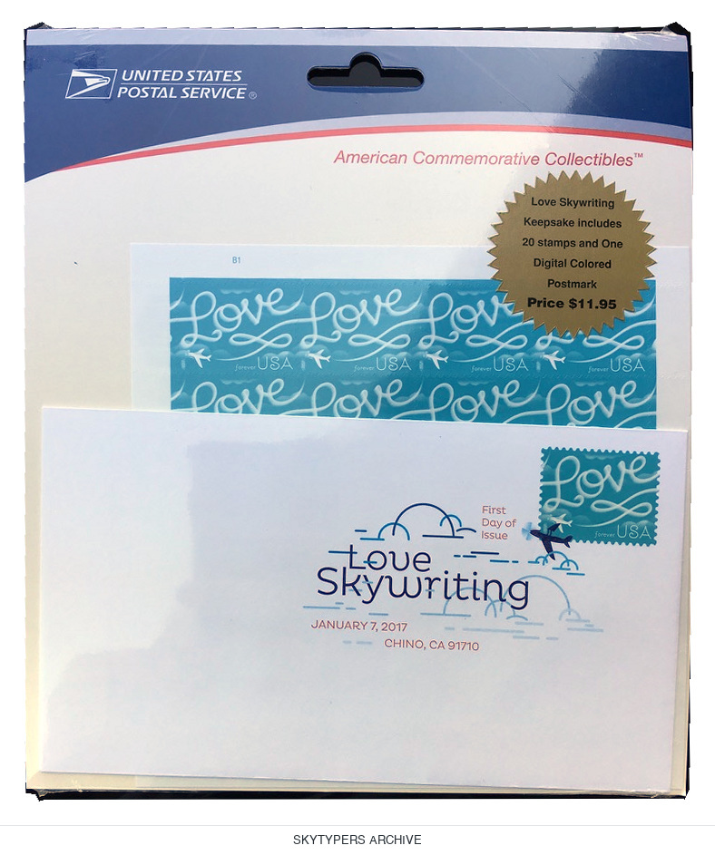 USPS Love Skywriting commemorative display with stamp artwork, an envelope and a Skytypers card.